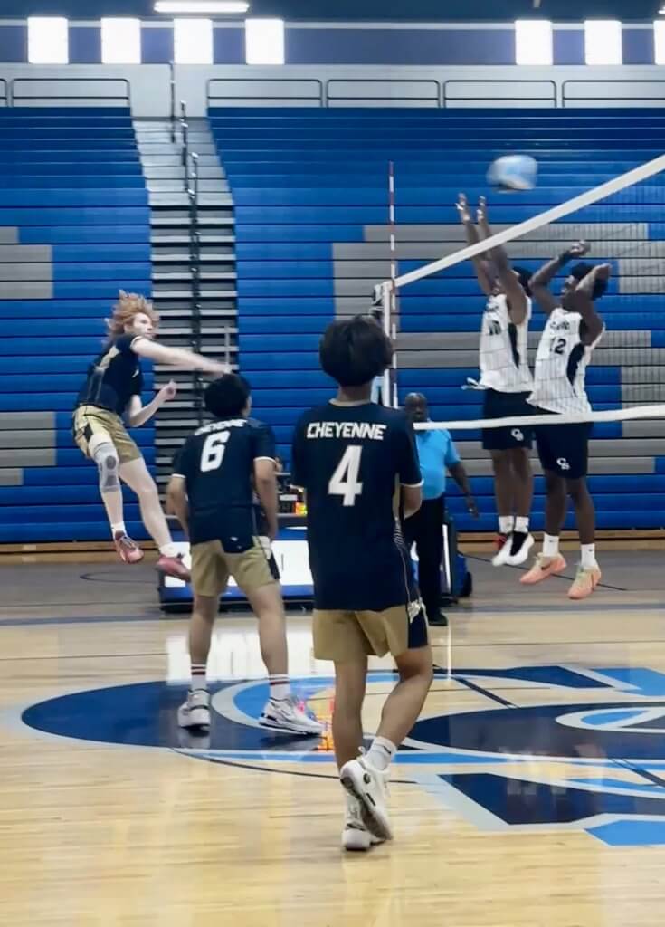 Cheyenne High School senior Hunter Perkins drills a kill past the Pioneer blockers on Friday, April 24.