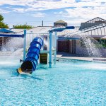 The Silver Mesa Park pool offers a water slide and children's play area.