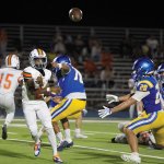 Mojave High School freshman quarterback Jaylyn Jackson attempts a pass under pressure at Moapa Valley High School on Friday, Aug. 28.