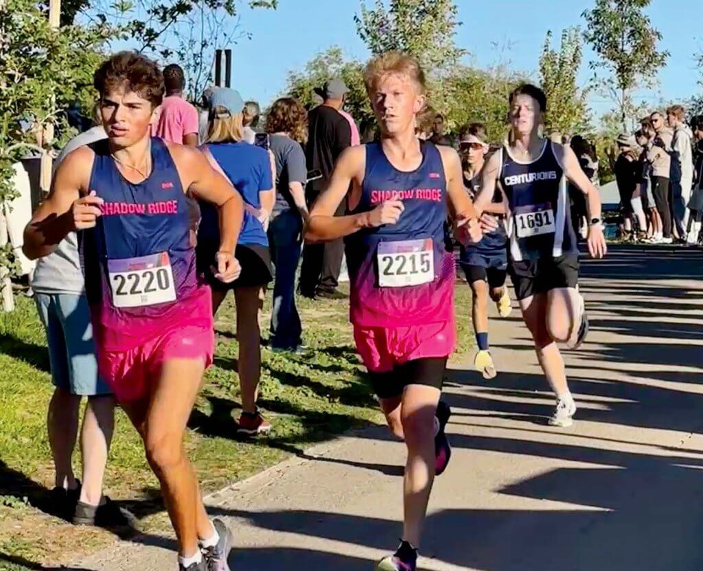 Shadow Ridge High School cross country runners Logan Larson (front) and McCouy Hackman start the CSN Invitational 5K in Las Vegas, Saturday, Oct. 3.
